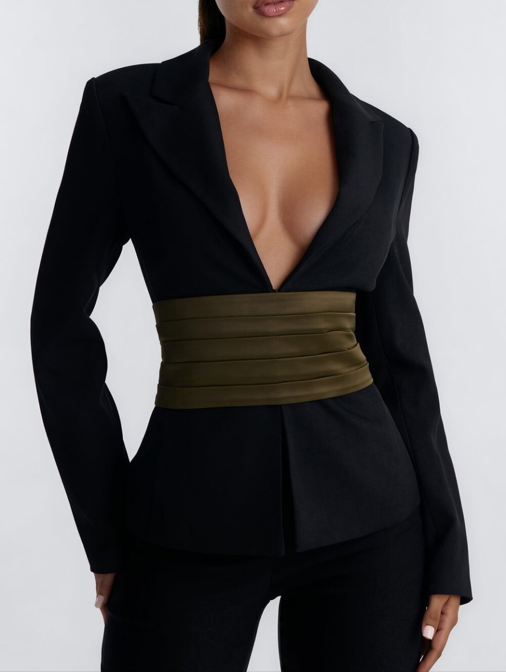 Stylish women's jacket with a fitted silhouette, made in black with a belt - cum